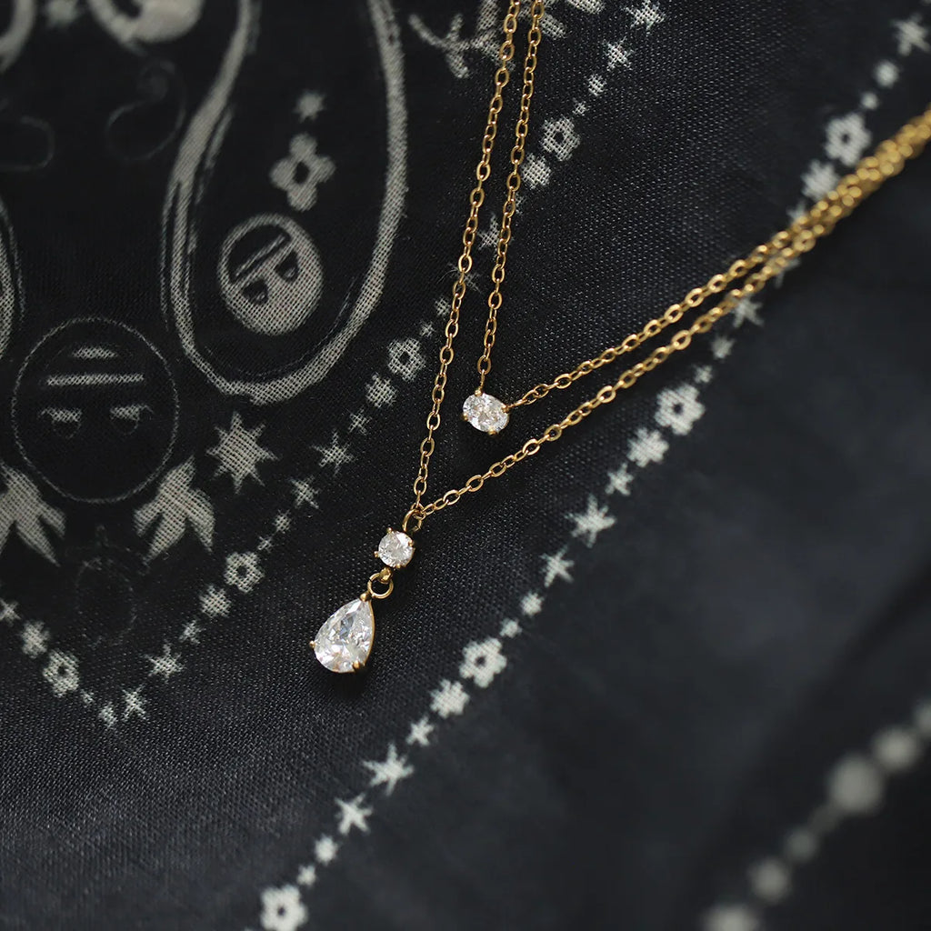 Collier Éclat de Goutte Double Chaîne Dorée en Acier Inoxydable & Zircon